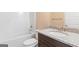 This bathroom features a tub with shower, a sink with granite countertop, and tile floors at 123 Oak Road, Locust Grove, GA 30248