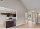 Modern kitchen featuring dark cabinets, stainless steel appliances, and an island with granite countertops at 123 Oak Road, Locust Grove, GA 30248