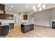 Contemporary kitchen featuring dark cabinets, granite countertops, and hardwood floors at 123 Oak Road, Locust Grove, GA 30248