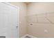 Laundry room featuring wood-look vinyl flooring, wire shelves, and washer hookups at 123 Oak Road, Locust Grove, GA 30248