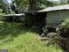Picture of an outbuilding with overgrown vegetation at 3136 Camp Branch Rd, Buford, GA 30519