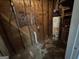 View of the basement featuring a Hotpoint water heater and unfinished walls at 4720 Ben Hill Rd, South Fulton, GA 30349