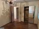 Bedroom view showcasing the closet with mirrored doors and chandelier at 4720 Ben Hill Rd, South Fulton, GA 30349