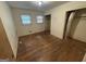 Bedroom with hardwood floors, two windows and a closet at 4720 Ben Hill Rd, South Fulton, GA 30349