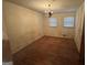 Bedroom with hardwood floors, chandelier and two windows at 4720 Ben Hill Rd, South Fulton, GA 30349