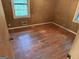 Bedroom featuring hardwood floors and natural light from two windows at 4720 Ben Hill Rd, South Fulton, GA 30349