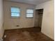 Bedroom with hardwood floors, two windows and a closet at 4720 Ben Hill Rd, South Fulton, GA 30349