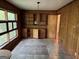 Dining room features vintage lamp, built in cabinets, wood paneling, and large windows at 4720 Ben Hill Rd, South Fulton, GA 30349