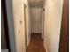 Hallway with white walls and hardwood flooring at 4720 Ben Hill Rd, South Fulton, GA 30349