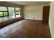 Bright living room with hardwood floors and large windows offering natural light and views at 4720 Ben Hill Rd, South Fulton, GA 30349