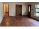 Living room with hardwood floors, closet, front door, and natural light at 4720 Ben Hill Rd, South Fulton, GA 30349