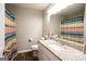 Cozy bathroom with granite counter and decorative shower curtain at 361 N Dogwood Ave, Social Circle, GA 30025