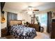Cozy bedroom with a ceiling fan, dresser, and natural light from a window at 361 N Dogwood Ave, Social Circle, GA 30025