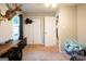 A bright bedroom with a large closet, neutral walls, and a view out of the window at 361 N Dogwood Ave, Social Circle, GA 30025