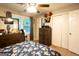Bright bedroom featuring a dresser and ample closet space at 361 N Dogwood Ave, Social Circle, GA 30025