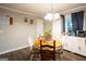 Dining area features a round table, chair seating, and an open-concept layout at 361 N Dogwood Ave, Social Circle, GA 30025