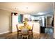 Cozy dining area adjacent to the kitchen features wood floors and natural light at 361 N Dogwood Ave, Social Circle, GA 30025