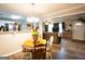 Dining area open to a spacious living room and kitchen with lots of natural light at 361 N Dogwood Ave, Social Circle, GA 30025