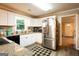 Modern kitchen with stainless steel appliances, ample counter space, and bright white cabinets at 361 N Dogwood Ave, Social Circle, GA 30025