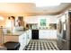 Bright kitchen features white cabinets, granite counters, and stainless steel appliances at 361 N Dogwood Ave, Social Circle, GA 30025