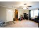Spacious living room with ample natural light, ceiling fan, and neutral walls at 361 N Dogwood Ave, Social Circle, GA 30025