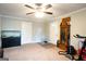 Spacious living room with neutral walls, white doors, and a ceiling fan at 361 N Dogwood Ave, Social Circle, GA 30025