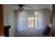 Bedroom featuring a large window, plush bedding, and carpet at 142 Kylee Ct, Villa Rica, GA 30180