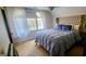 Bedroom with a large window, plush bedding, and light-colored carpet at 142 Kylee Ct, Villa Rica, GA 30180