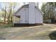 Home exterior featuring gray siding, well-kept landscaping, and concrete driveway at 142 Kylee Ct, Villa Rica, GA 30180