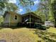Exterior view of home showcasing a slide off of screened-in porch at 324 Bells Ferry Ne Rd, White, GA 30184