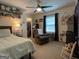 Cozy bedroom featuring a comfortable bed, chair, and shelves, offering a relaxing retreat at 324 Bells Ferry Ne Rd, White, GA 30184