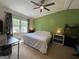 Bright bedroom with green accent wall and large window, offering plenty of natural light at 324 Bells Ferry Ne Rd, White, GA 30184