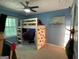 A bright bedroom featuring a loft bed, desk, climbing wall and natural lighting from the window at 324 Bells Ferry Ne Rd, White, GA 30184