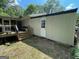 Exterior view of home featuring backyard access and storage at 324 Bells Ferry Ne Rd, White, GA 30184