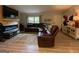 Comfortable living room with a large sectional sofa and a stylish area rug at 324 Bells Ferry Ne Rd, White, GA 30184