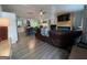 Open-concept living room featuring wood-look floors and a modern electric fireplace at 324 Bells Ferry Ne Rd, White, GA 30184