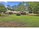 The home features a verdant backyard and private deck, perfect for outdoor entertainment and relaxation at 502 Pine Cir, Peachtree City, GA 30269