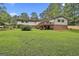 This home offers a gorgeous backyard with a private deck, perfect for relaxation and outdoor living at 502 Pine Cir, Peachtree City, GA 30269