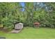 Large backyard with a storage shed and a gazebo, ideal for outdoor activities and relaxation at 502 Pine Cir, Peachtree City, GA 30269