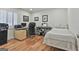 Multi-use room featuring a bed, desk, and keyboard at 502 Pine Cir, Peachtree City, GA 30269