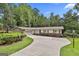 Home featuring a well-maintained yard and landscaping, with a driveway leading to an attached garage at 502 Pine Cir, Peachtree City, GA 30269