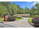 Well-maintained home with a long driveway and lush landscaping, offering great curb appeal at 502 Pine Cir, Peachtree City, GA 30269