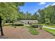 Charming single-story home with stone and siding, complemented by a lush, green front yard at 502 Pine Cir, Peachtree City, GA 30269