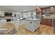 The kitchen flows to the living room and features stainless appliances and wood cabinets at 502 Pine Cir, Peachtree City, GA 30269