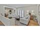 Comfortable living room with hardwood floors, neutral furniture, and ample natural light at 502 Pine Cir, Peachtree City, GA 30269