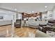 Spacious living room connected to kitchen with hardwood floors and seating at 502 Pine Cir, Peachtree City, GA 30269