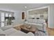 Cozy living space featuring hardwood floors, an area rug, and comfortable seating arrangements at 502 Pine Cir, Peachtree City, GA 30269