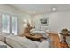 Cozy living room with neutral furniture and hardwood floors at 502 Pine Cir, Peachtree City, GA 30269