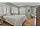 Main bedroom with white bedding and shuttered windows at 502 Pine Cir, Peachtree City, GA 30269