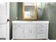 Bathroom featuring a large vanity with white cabinets and a large framed mirror at 2795 Hawthorne Dr, Atlanta, GA 30345
